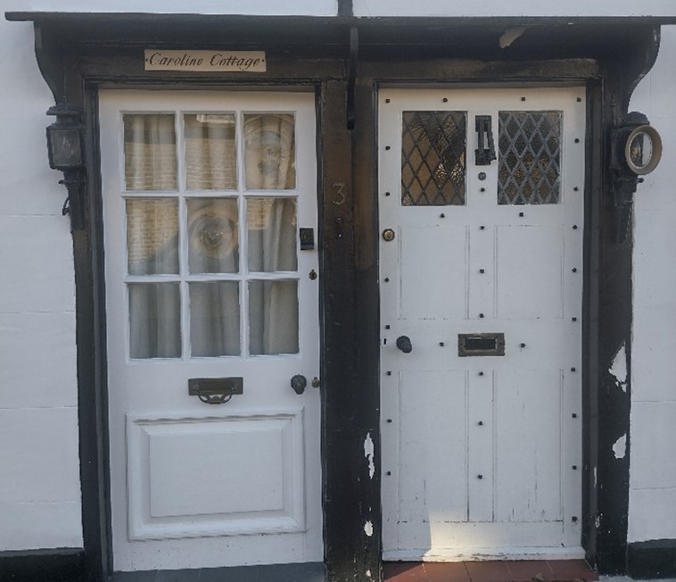 Figure 197 Pair of doors in Vine Row showing a replacement door beside an original