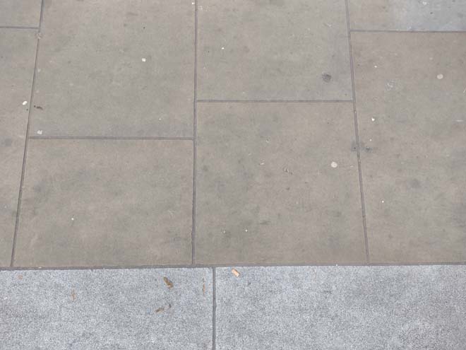 Fig. 67: Good quality pavers are present at the south end of Queen's Road, and granite kerbs can be found throughout