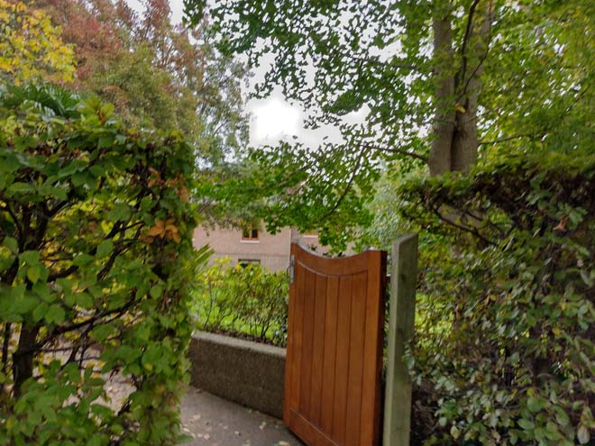 Fig. 138: Houses are glimpsed through gaps in hedges or trees