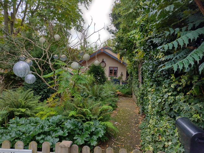 Fig. 141: A typical single storey cottage with mature gardens around